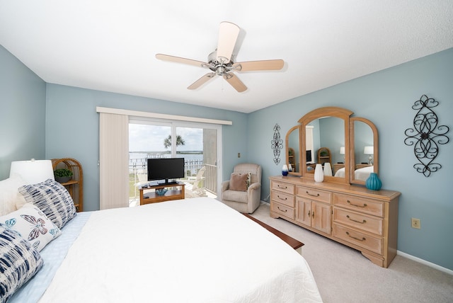 bedroom with ceiling fan and light colored carpet