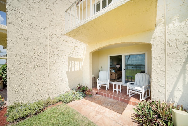 entrance to property with a balcony