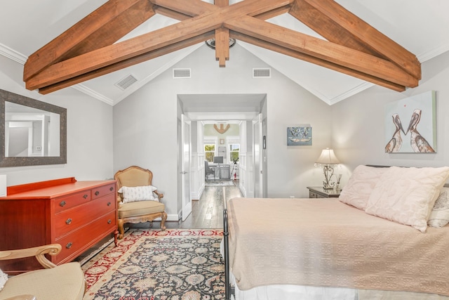 bedroom with ornamental molding, light wood-type flooring, and vaulted ceiling with beams