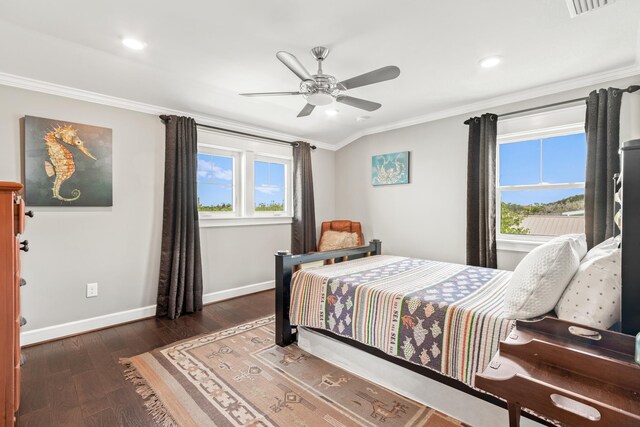 bedroom with ceiling fan, dark wood-type flooring, and crown molding