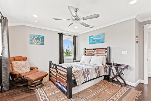 bedroom featuring crown molding, dark hardwood / wood-style floors, and ceiling fan