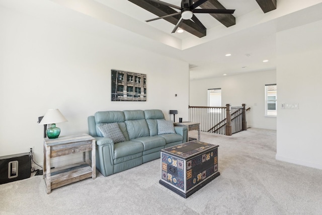 carpeted living room featuring recessed lighting, a tray ceiling, baseboards, and a ceiling fan