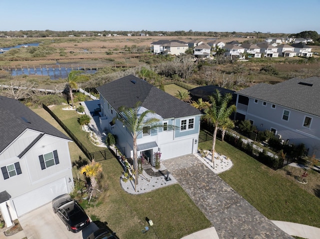 birds eye view of property featuring a residential view and a water view