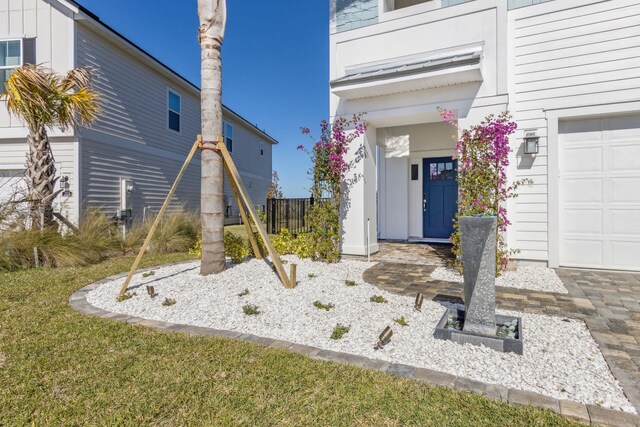 entrance to property with a garage and board and batten siding