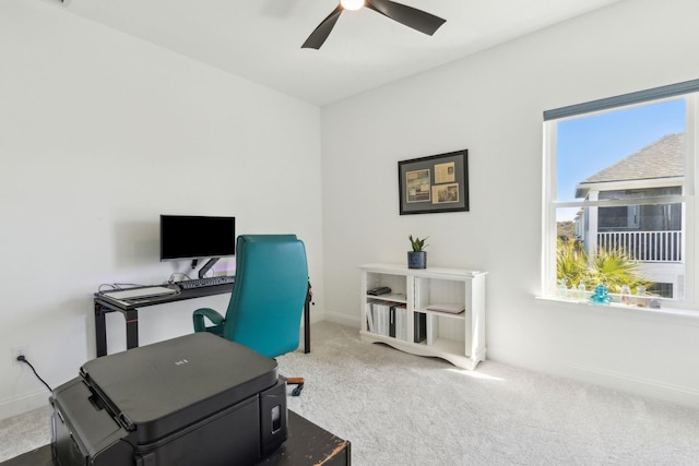 office featuring ceiling fan, baseboards, and carpet