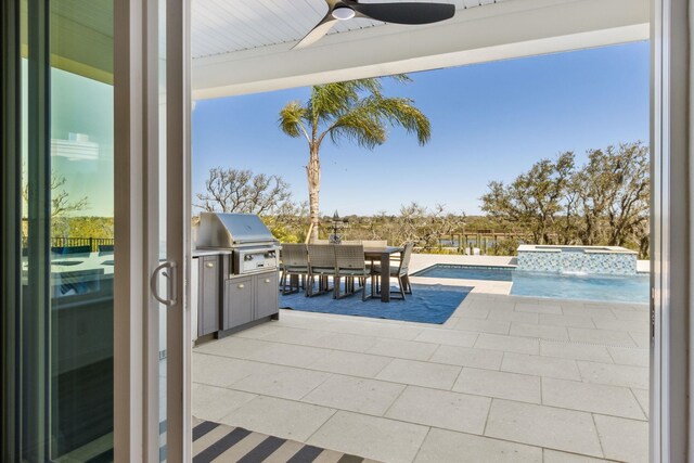 view of patio featuring grilling area, outdoor dining area, a ceiling fan, and a pool with connected hot tub