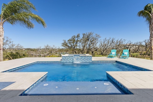 view of swimming pool with a patio area and a pool with connected hot tub