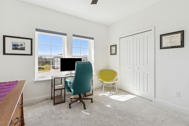 office featuring carpet flooring, a ceiling fan, and baseboards