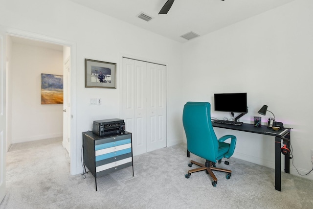 home office with visible vents, carpet floors, and a ceiling fan