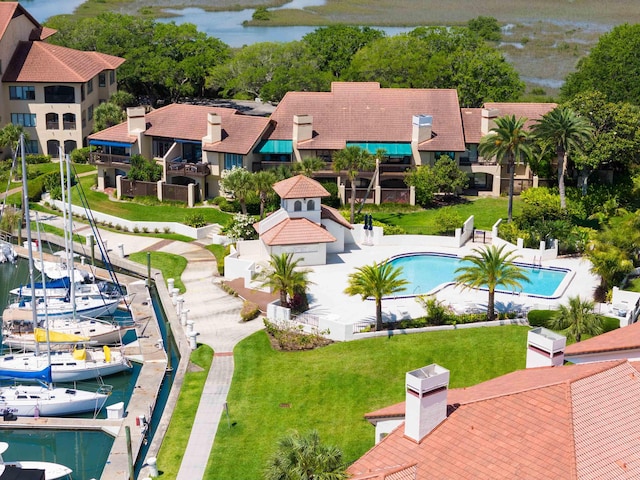 birds eye view of property with a water view