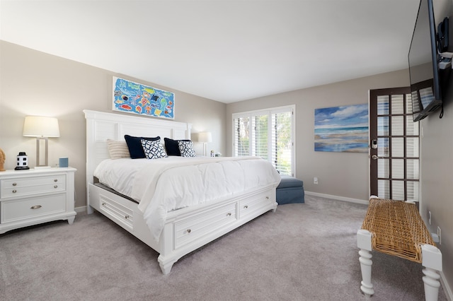 bedroom with light colored carpet