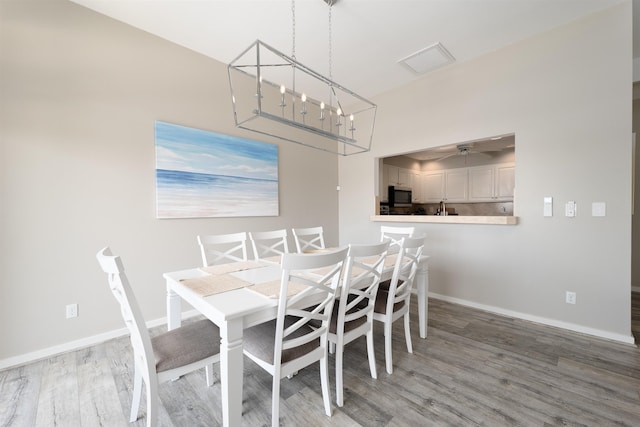 unfurnished dining area featuring hardwood / wood-style flooring