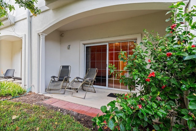 property entrance featuring a patio area