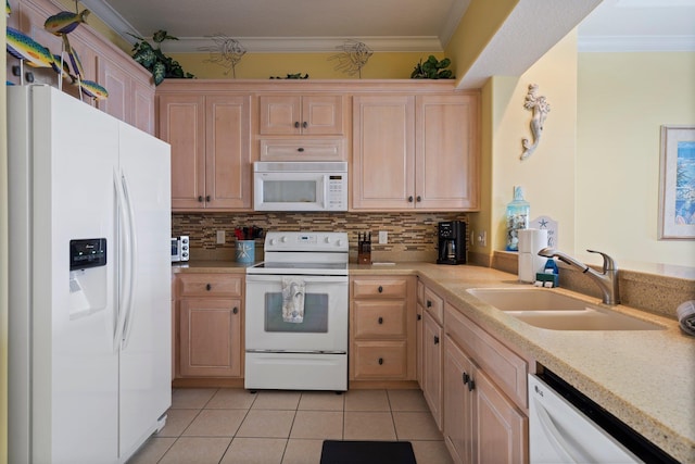 kitchen with light brown cabinetry, sink, white appliances, and light tile patterned floors