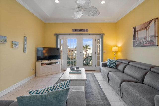 tiled living room featuring ceiling fan, crown molding, and french doors