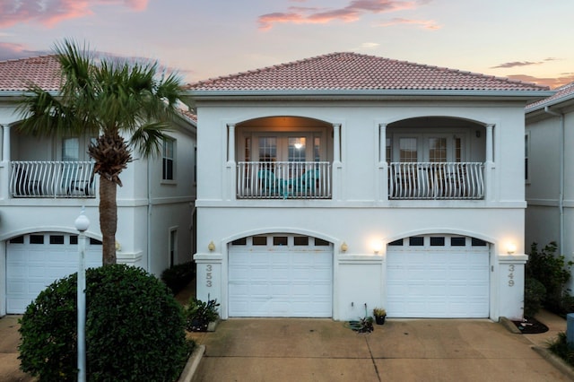 mediterranean / spanish-style home featuring a balcony