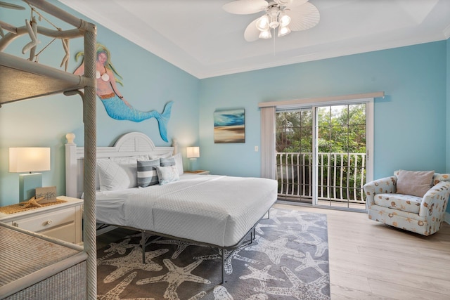 bedroom featuring ceiling fan, light hardwood / wood-style floors, ornamental molding, and access to outside