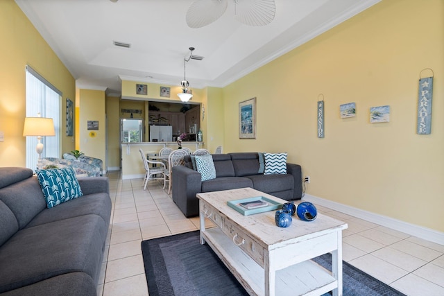 living room with ceiling fan, light tile patterned floors, and ornamental molding