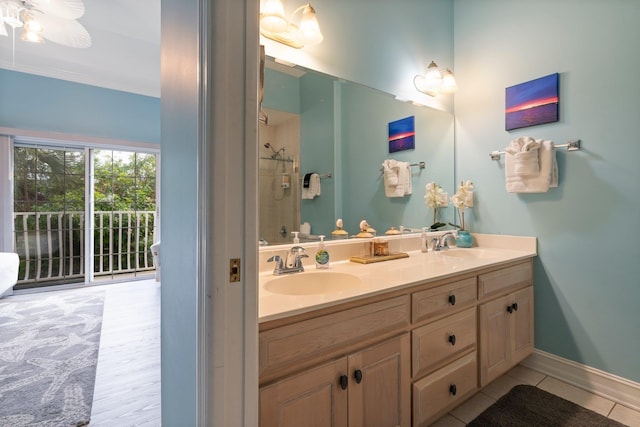 bathroom with ceiling fan, vanity, and tile patterned flooring