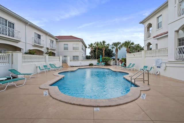 view of swimming pool featuring a patio area