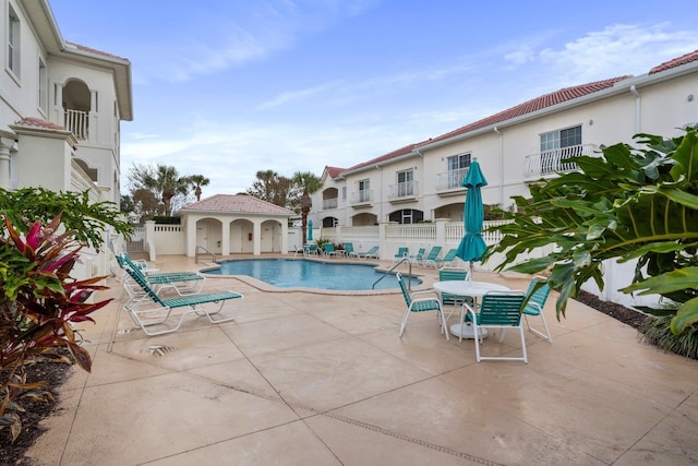 view of swimming pool with a patio