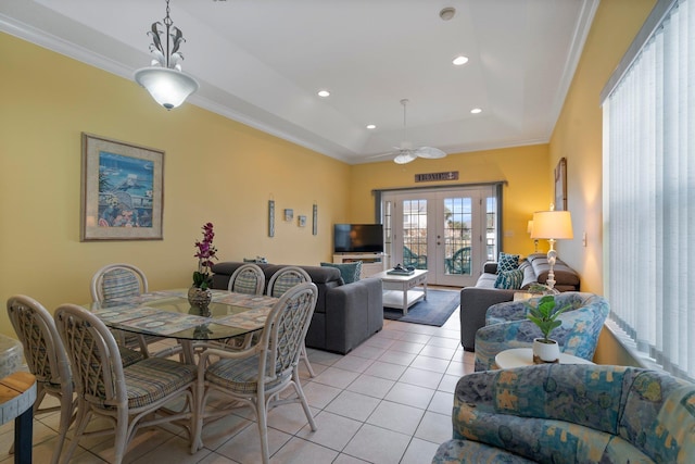 dining room with light tile patterned floors, crown molding, and french doors