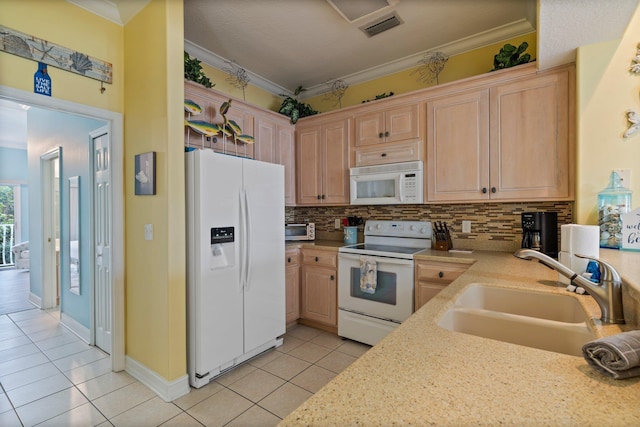 kitchen featuring white appliances, light brown cabinets, sink, ornamental molding, and light tile patterned floors