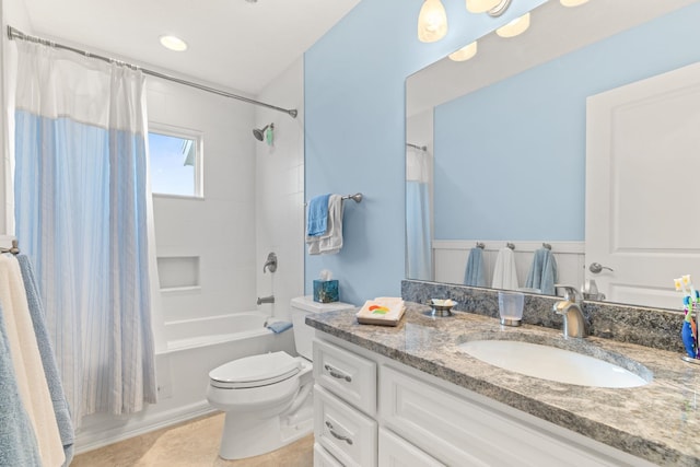 full bathroom featuring tile patterned flooring, vanity, shower / bathtub combination with curtain, and toilet