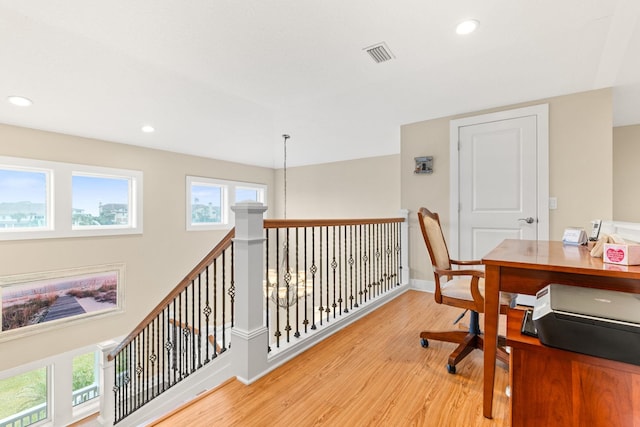 office area featuring a wealth of natural light and light hardwood / wood-style floors