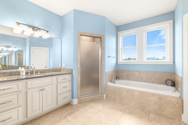 bathroom featuring tile patterned floors, separate shower and tub, and vanity