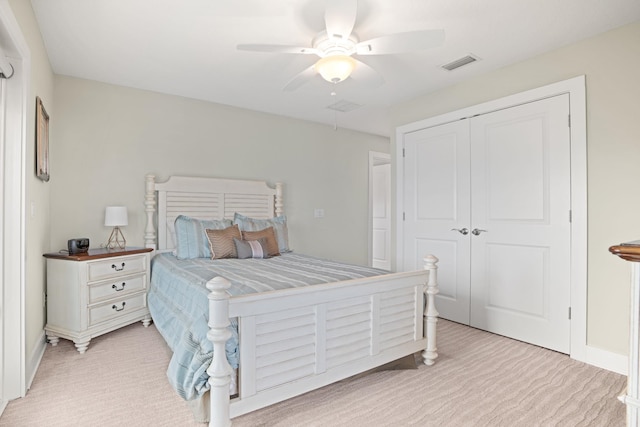 bedroom with light carpet, a closet, and ceiling fan