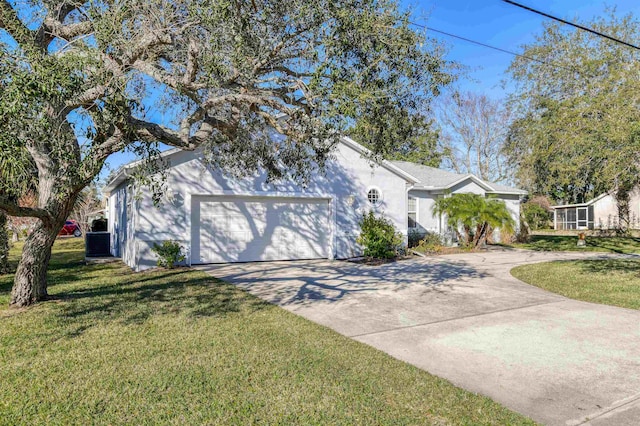 view of front of property with a front yard and a garage