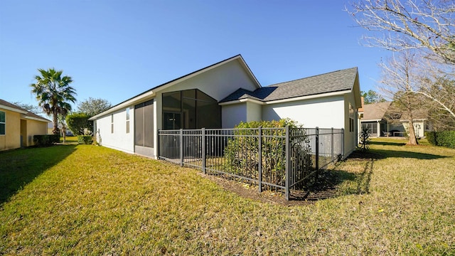 view of side of property with a lawn