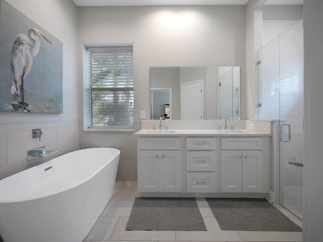 847 Tides End Dr, Saint Augustine, FL 32080 - full bath featuring tile patterned floors, double vanity, a stall shower, and a sink