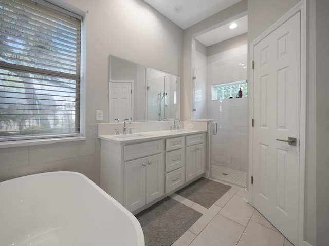 847 Tides End Dr, Saint Augustine, FL 32080 - bathroom featuring a shower stall, tile patterned flooring, double vanity, and a sink