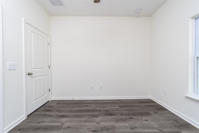 empty room with dark hardwood / wood-style floors