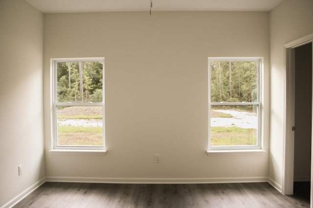 empty room with dark hardwood / wood-style floors