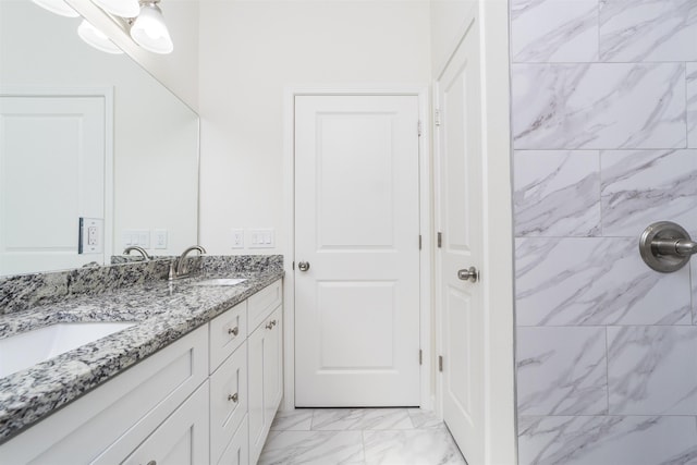 4350 Theresa St, Hastings, FL 32145 - bathroom featuring marble look tile flooring, double vanity, and a tile shower