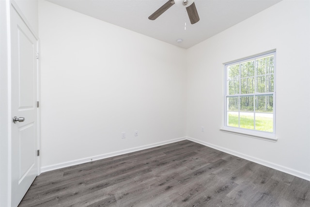 empty room featuring ceiling fan and dark wood-type flooring