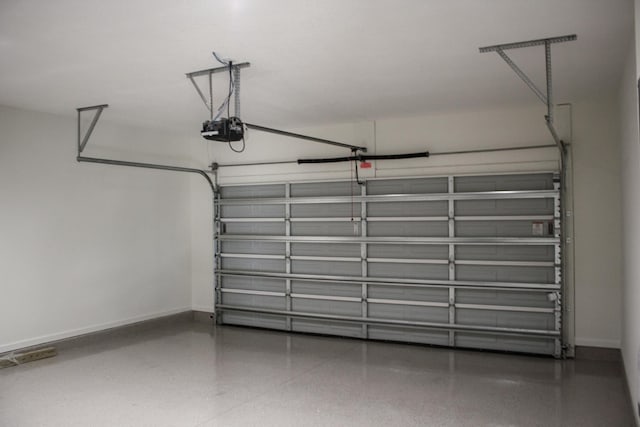 4350 Theresa St, Hastings, FL 32145 - garage with a garage door opener and baseboards