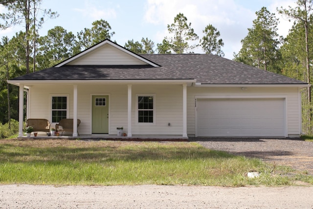 4350 Theresa St, Hastings, FL 32145 - view of front facade featuring roof with shingles, gravel driveway, and an attached garage