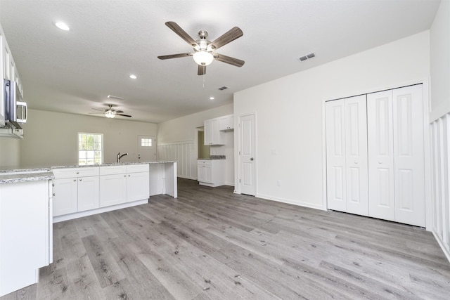 4350 Theresa St, Hastings, FL 32145 - unfurnished living room with ceiling fan, light wood finished floors, and recessed lighting