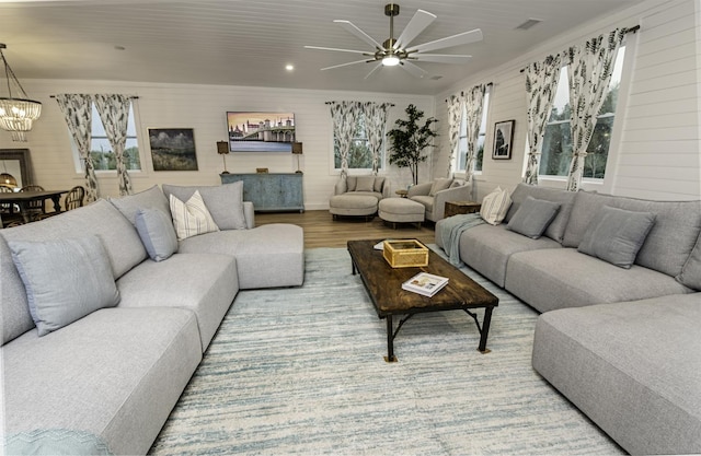 16/18/20 Inlet Pl, Saint Augustine, FL 32080 - living area featuring a chandelier, a ceiling fan, wood finished floors, and wooden walls