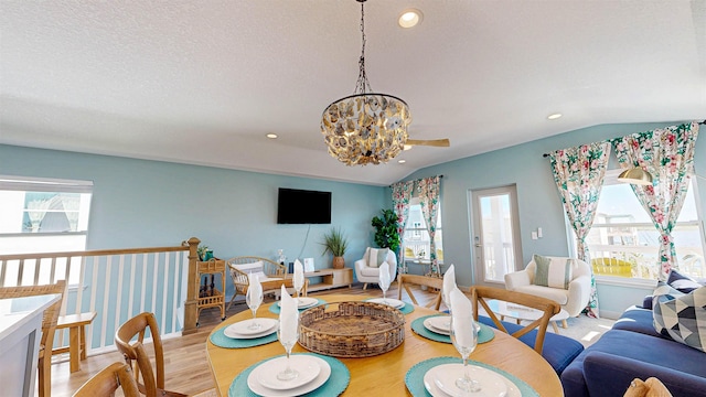 16/18/20 Inlet Pl, Saint Augustine, FL 32080 - dining space with light wood-style flooring, plenty of natural light, vaulted ceiling, recessed lighting, and a chandelier