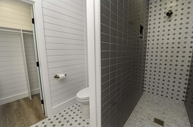 16/18/20 Inlet Pl, Saint Augustine, FL 32080 - bathroom featuring a stall shower, toilet, and baseboards