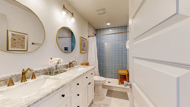 16/18/20 Inlet Pl, Saint Augustine, FL 32080 - full bathroom with toilet, marble finish flooring, tiled shower, and double vanity