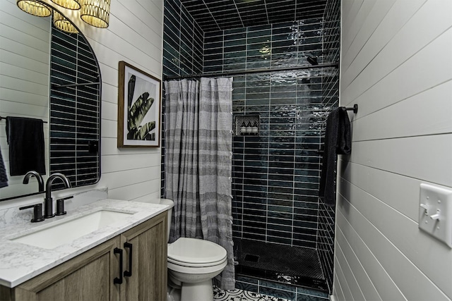16/18/20 Inlet Pl, Saint Augustine, FL 32080 - bathroom with wood walls, a stall shower, vanity, and toilet