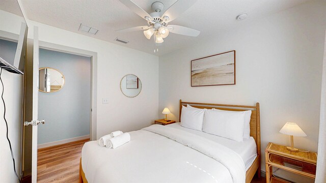 16/18/20 Inlet Pl, Saint Augustine, FL 32080 - bedroom with light wood-type flooring, baseboards, and a ceiling fan