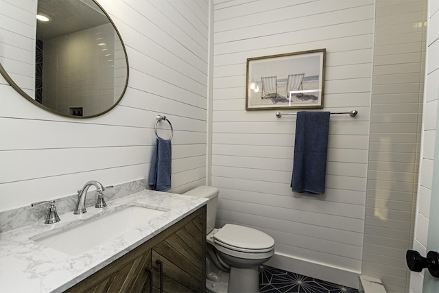 16/18/20 Inlet Pl, Saint Augustine, FL 32080 - bathroom with wooden walls, toilet, and vanity