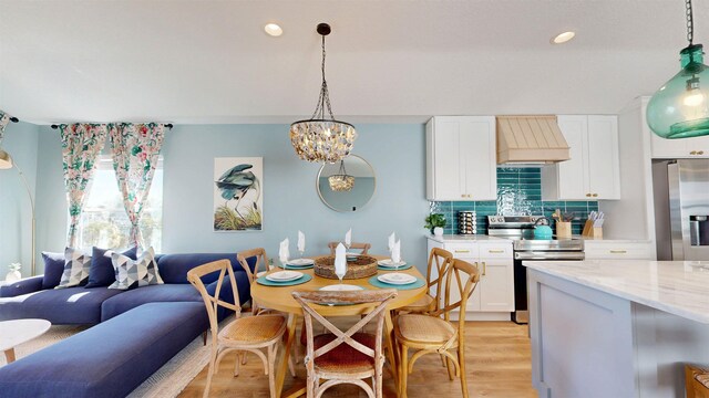 16/18/20 Inlet Pl, Saint Augustine, FL 32080 - dining room with light wood finished floors, recessed lighting, and a chandelier